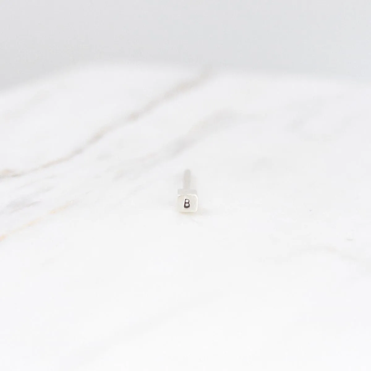 Single Element Initial Stud